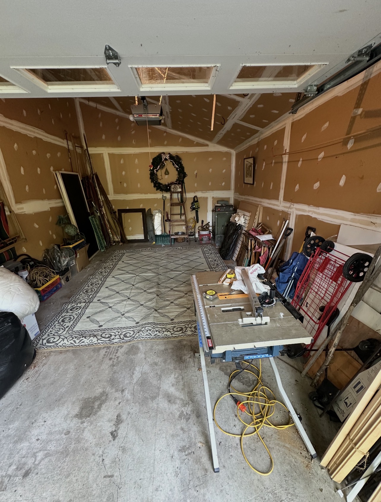 Same garage after cleanout — floor cleared and organized